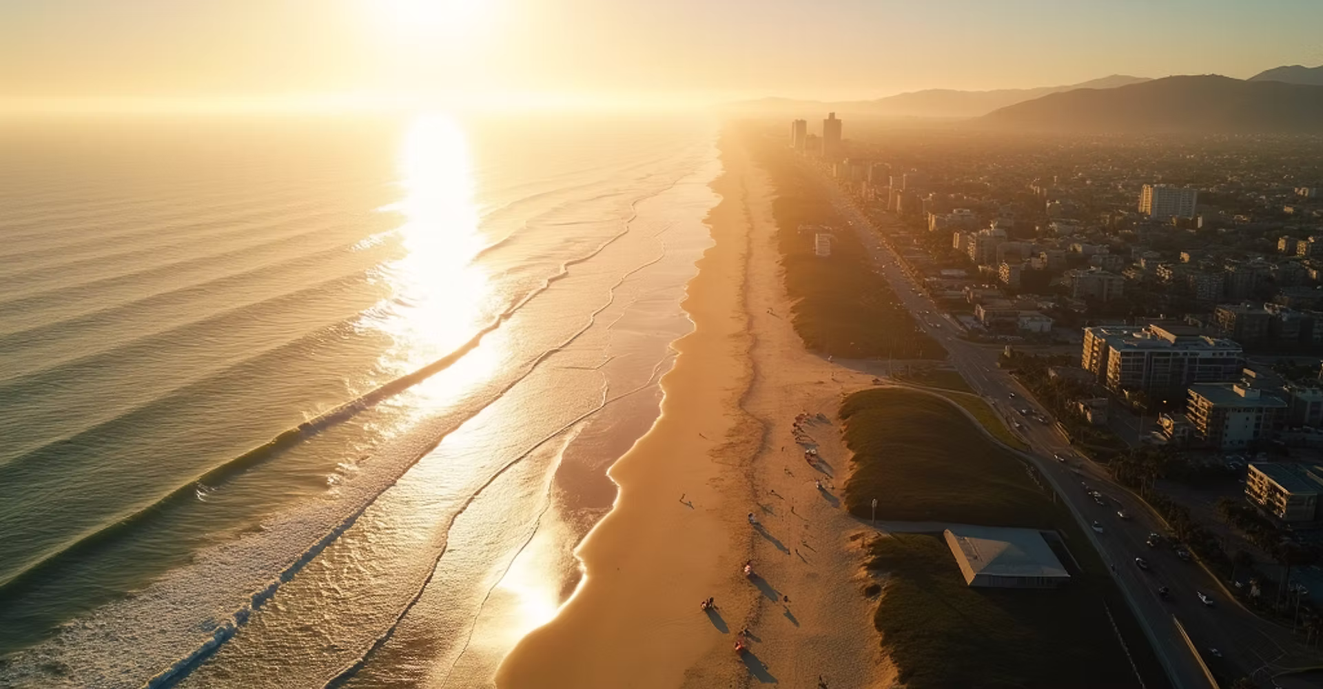 A breathtaking aerial view of the Redondo Beach coastline at golden hour, showcasing spark
